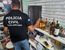 Shopping Popular vira “fábrica” de uísque falso: Polícia Civil apreende 444 garrafas e prende quatro em Cuiabá